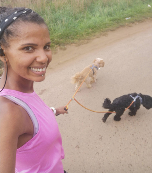 Ashli Sterling walking two dogs