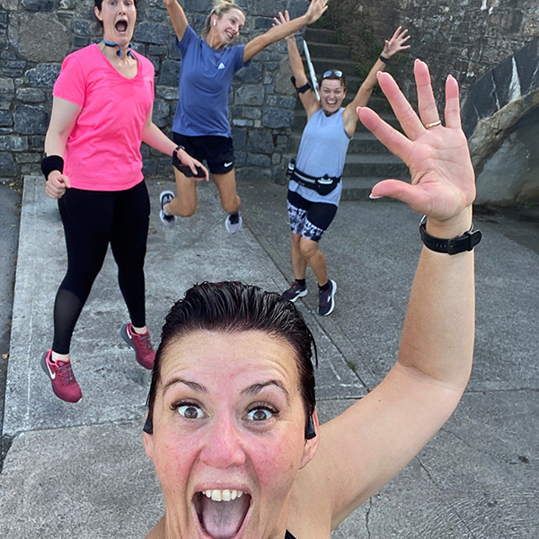 Slimming World Consultant smiling and waving with three friends